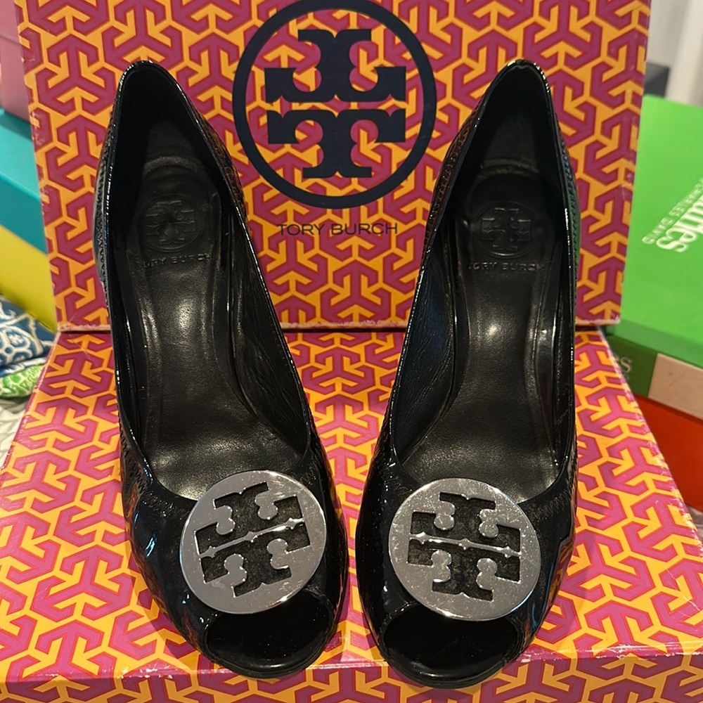 Tory Burch black patent leather wedge heel.